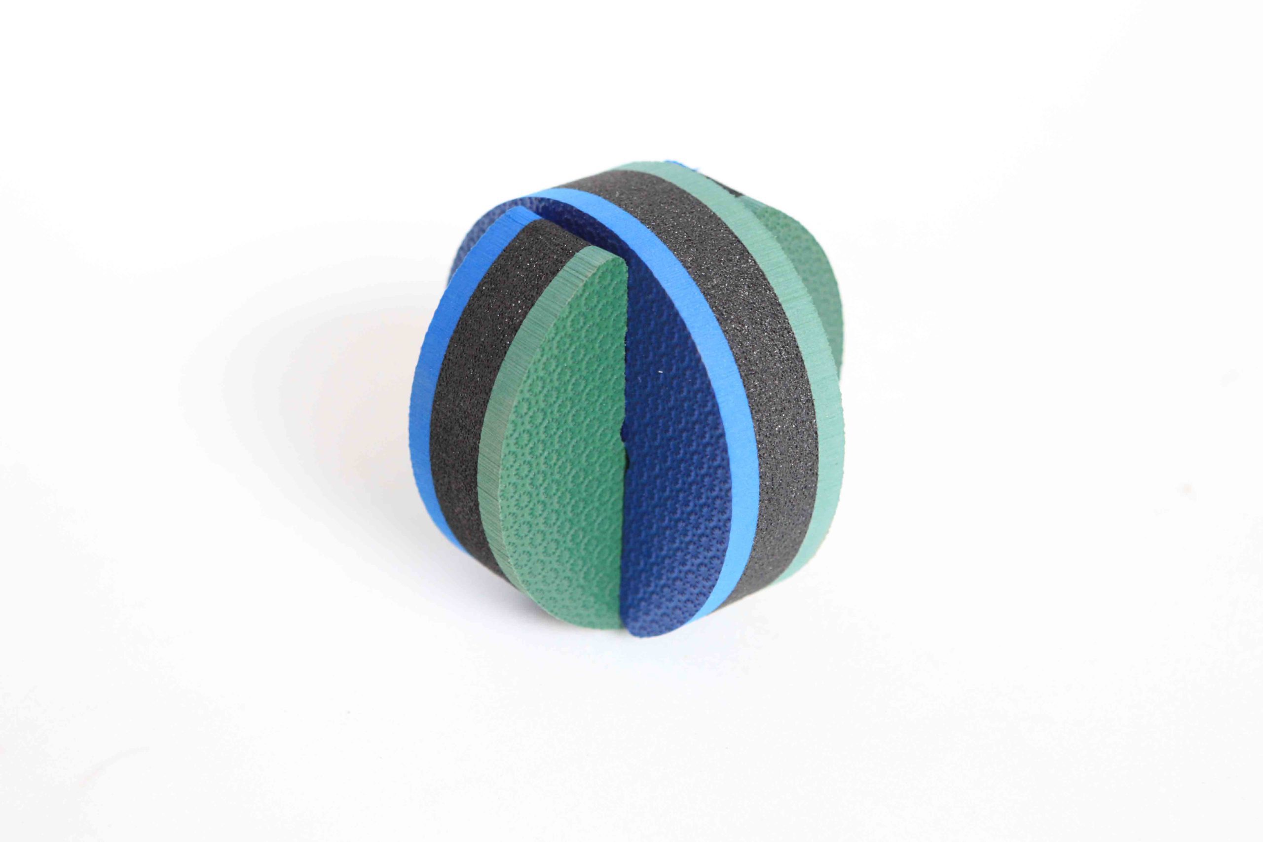 laminated different colours and grades of foam. Green foam has embossed texture