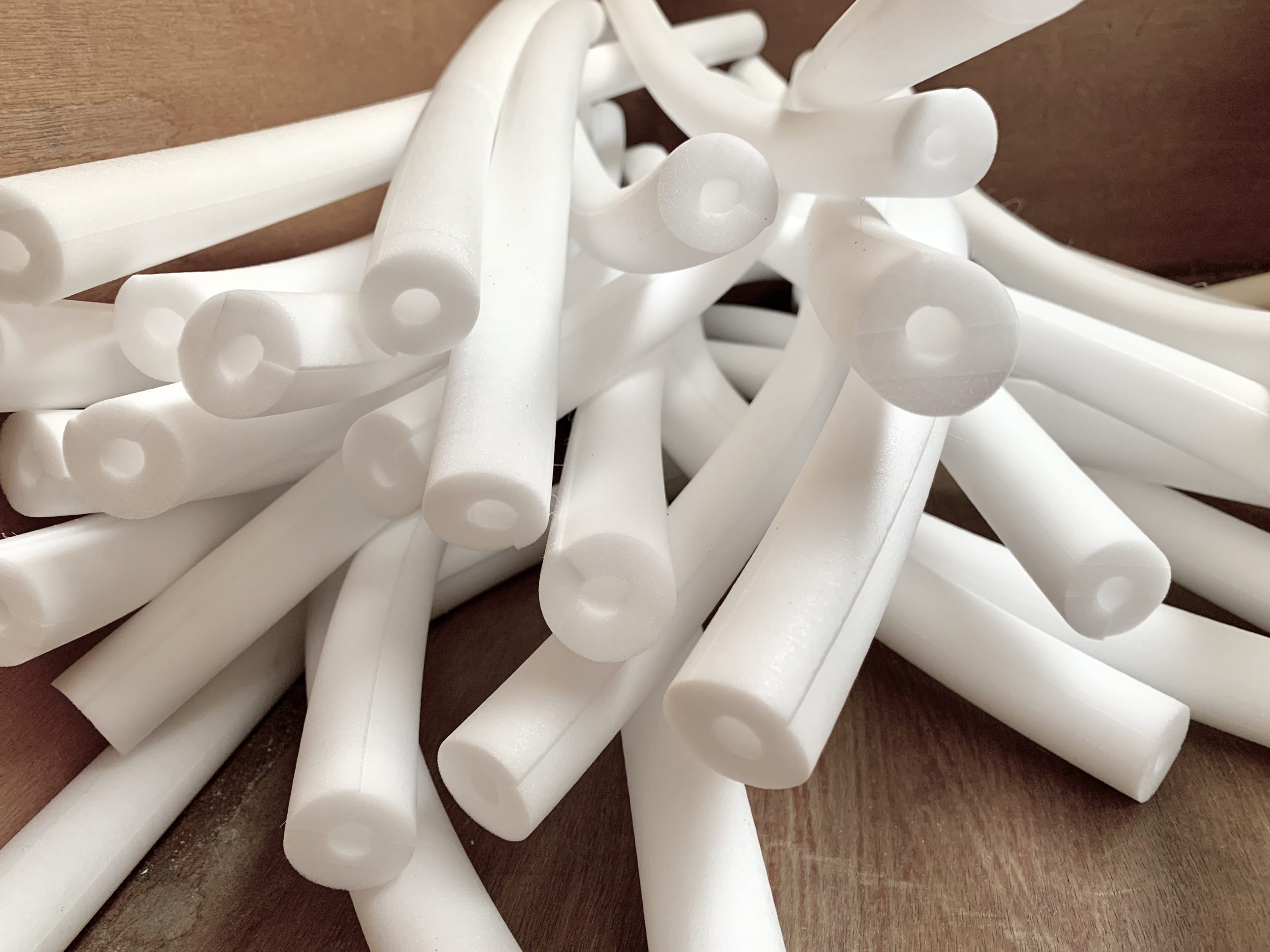 white tubing foam, closed cell foam insulation, starts as a foam block that is converted into foam strip and machined into tubing or cord