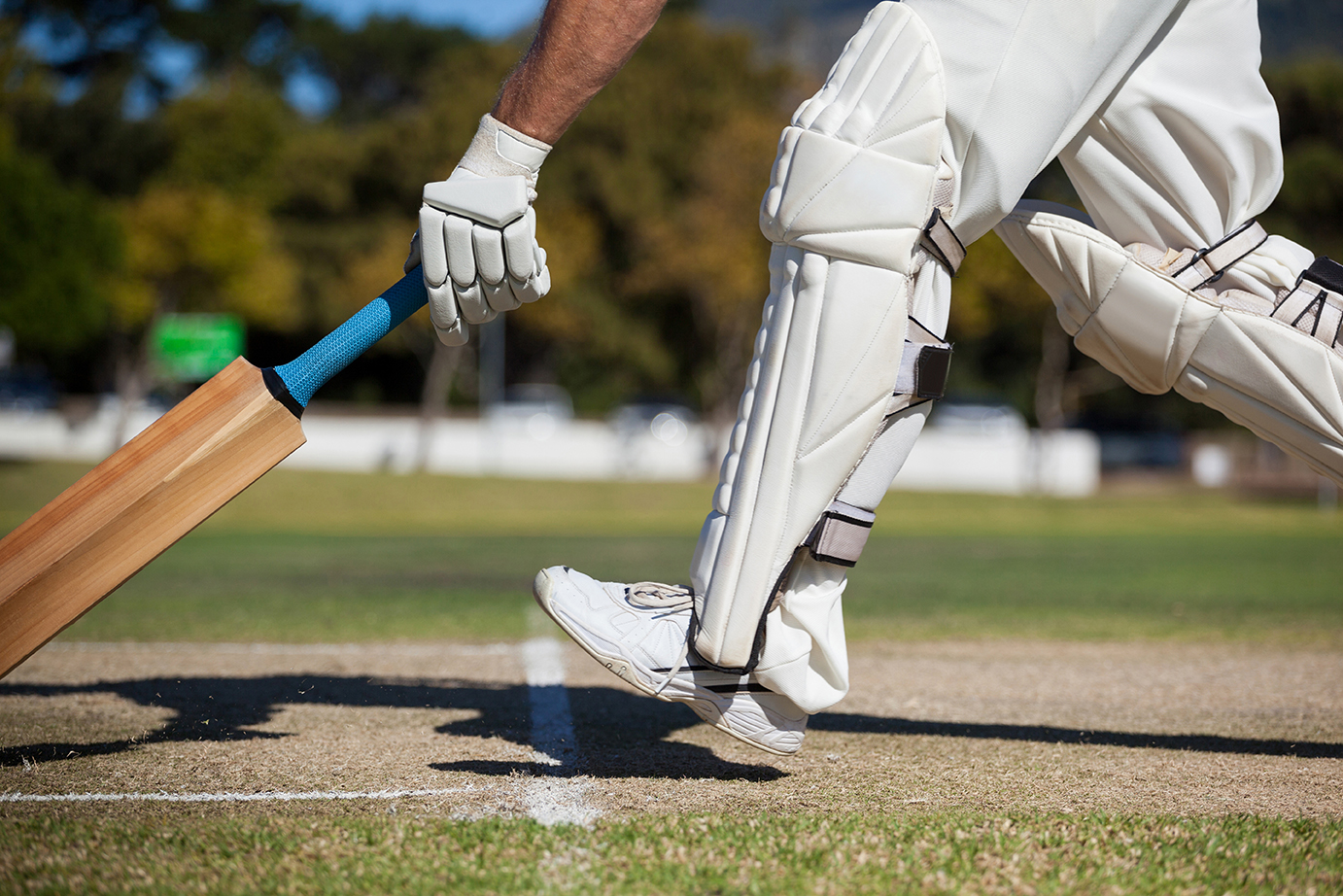 cricket player with leg shields that contain evazote foam